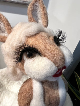 Use eyelashes to enhance your felted character's eyes...